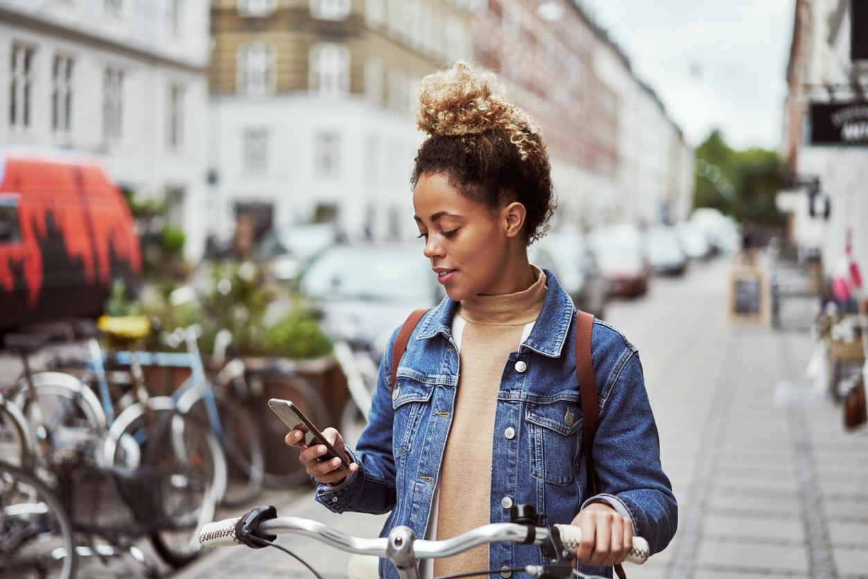 Young woman looking at her mobile phone