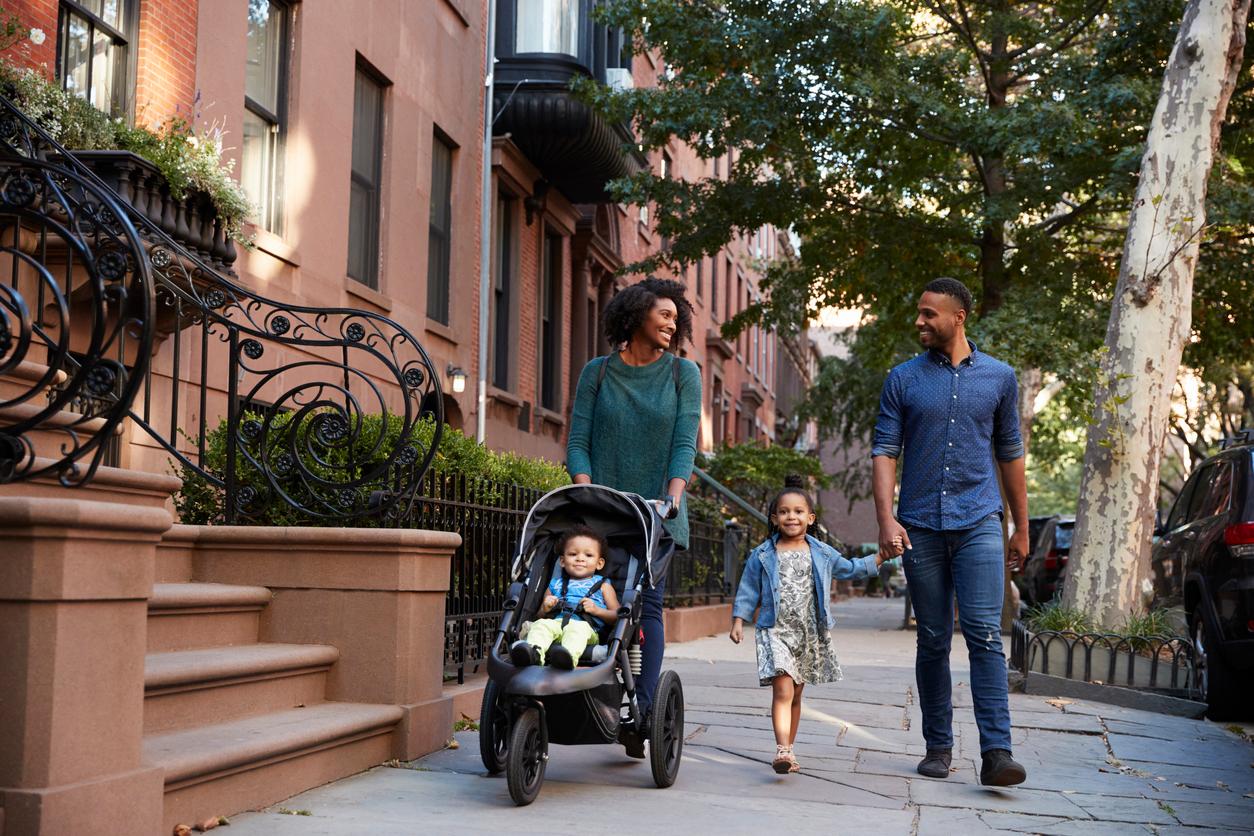 Mother and father with two young children in Brooklyn, New York City